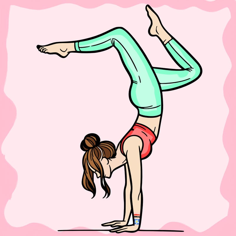 a woman doing a handstand