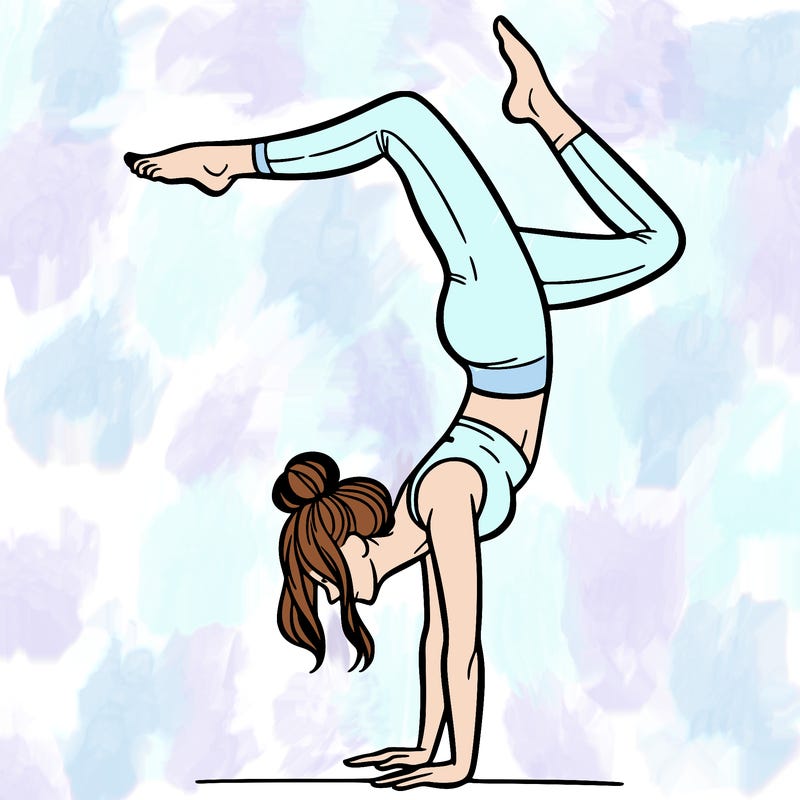 a woman doing a handstand