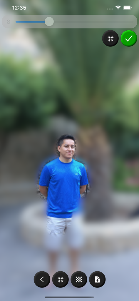 Blur Image - A man in a blue shirt with a heavily blurred background using the Blur Image app interface