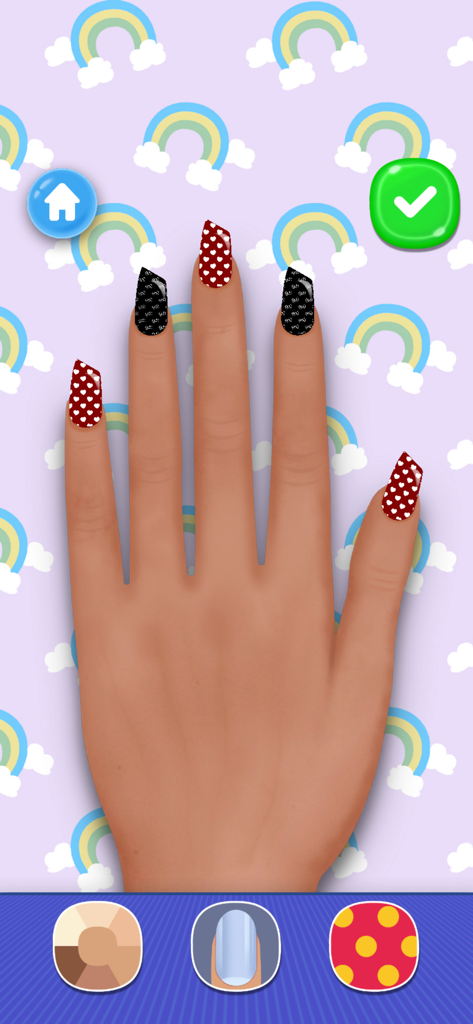 Girls Nail Salon: Paint,Polish - Una mano con uñas acrílicas largas con patrones de corazón rojos y negros en un juego de salón de uñas para niñas.