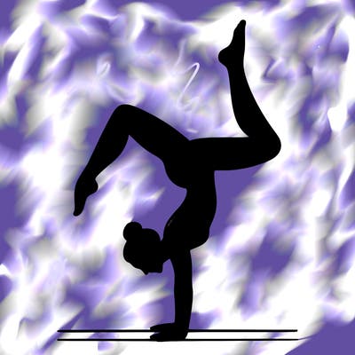 a woman doing a handstand