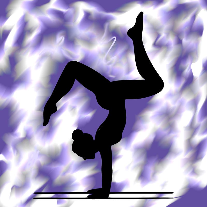 a woman doing a handstand