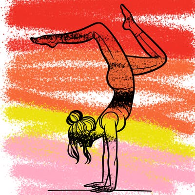 a woman doing a handstand