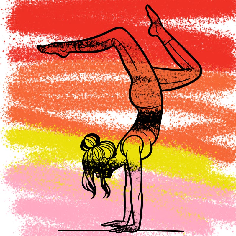 a woman doing a handstand