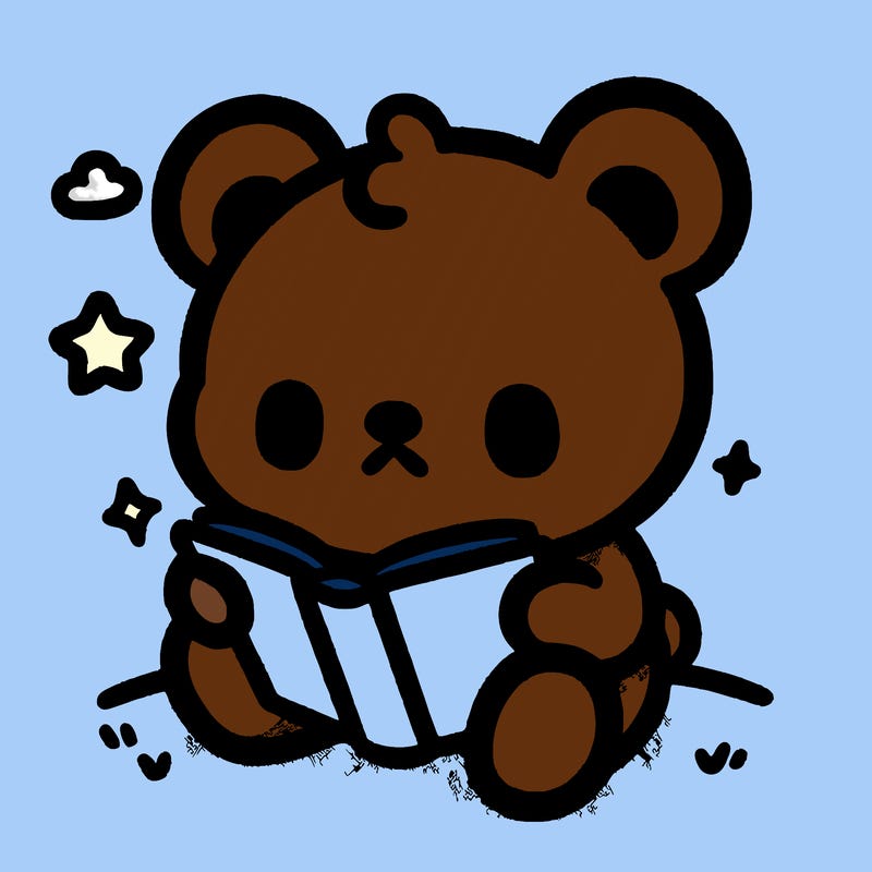 cute bear that's sitting down and reading a book