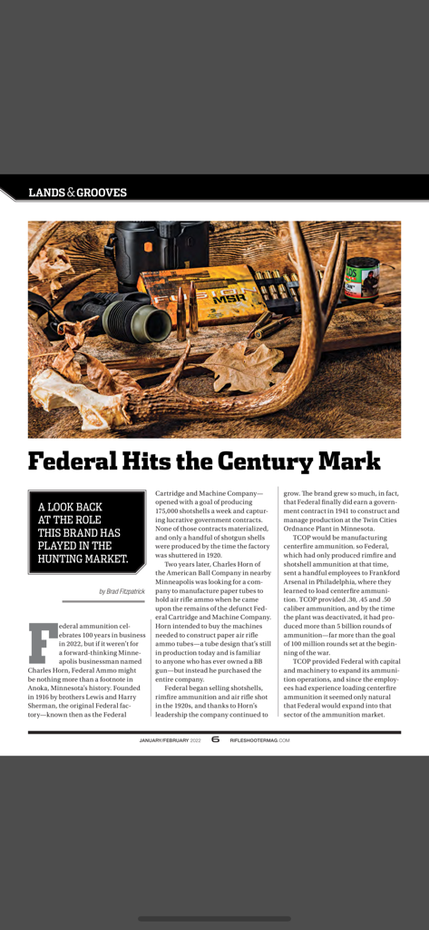 Rifleshooter - Rifleshooter App Screenshot mit einem Artikel über die Geschichte von Federal Ammunition mit einem Bild von Jagdausrüstung und einem Hirschgeweih
