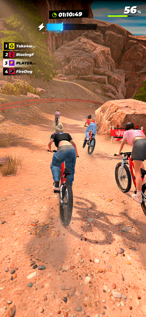 RUSH: Xtreme - Third person view of players racing mountain bikes on a dirt track in RUSH Xtreme