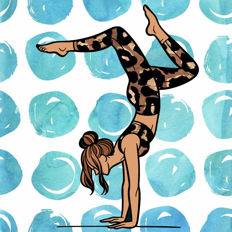 a woman doing a handstand