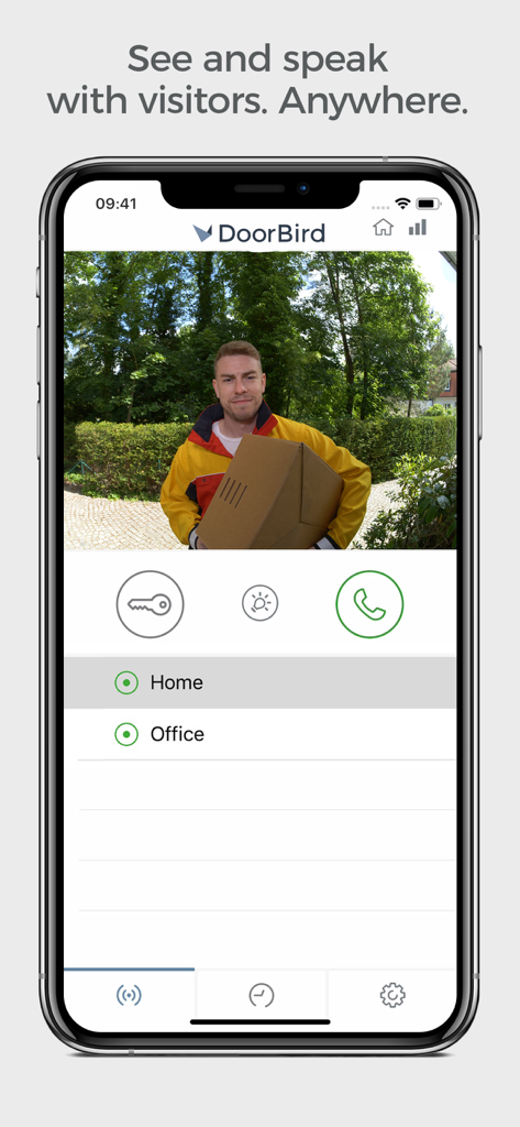 DoorBird app interface showing a live video feed of a delivery person at the front door with options to communicate and unlock