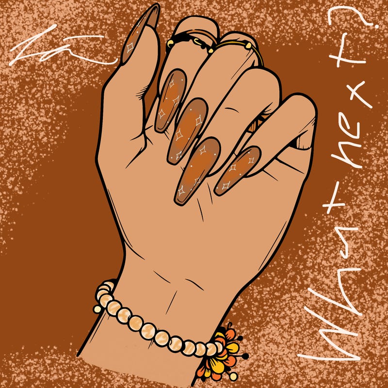 a hand with acrylic nails ,only hand,the hand is wearing a bracelet