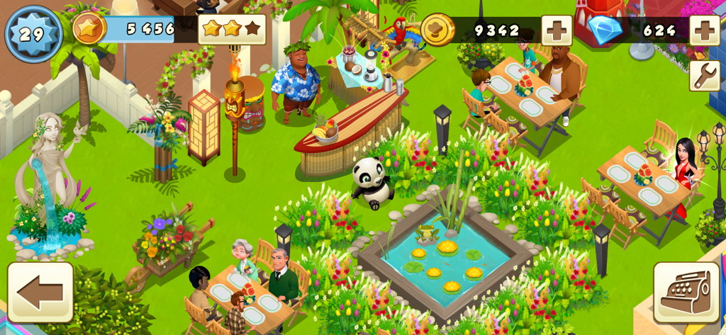 World Chef - A vibrant outdoor dining area in World Chef featuring decorative flower beds, a lily pond, and a tiki bar.