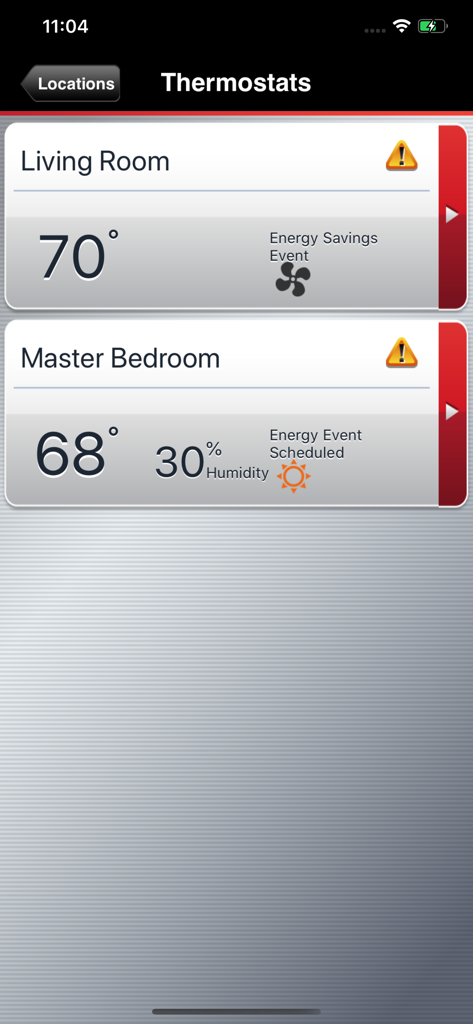 Total Connect Comfort - Total Connect Comfort app interface displaying temperature and humidity readings for living room and master bedroom thermostats.