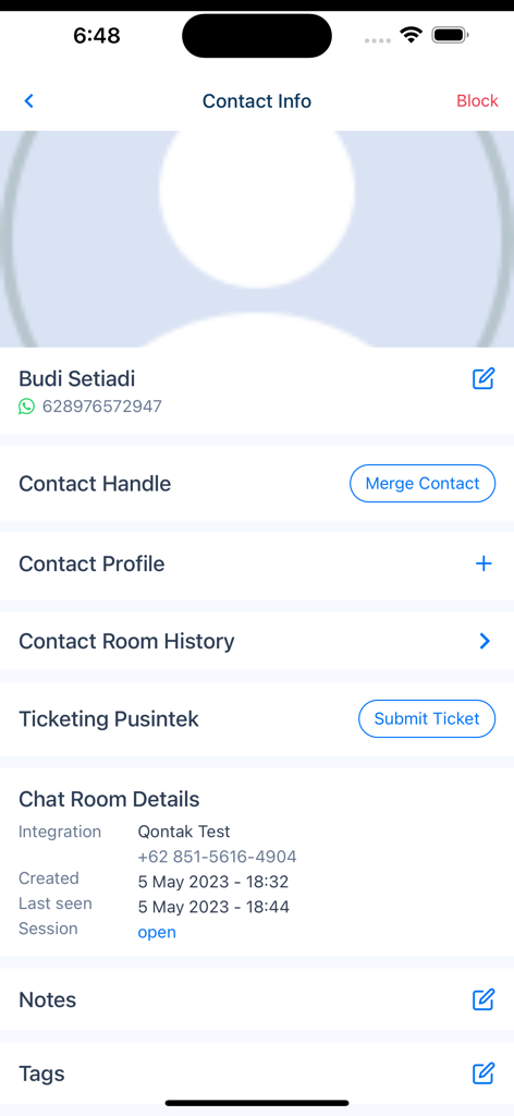A screenshot of the Qontak Chat app displaying detailed customer contact information including chat history and ticketing options