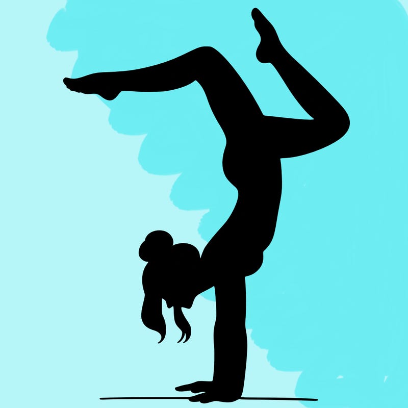 a woman doing a handstand