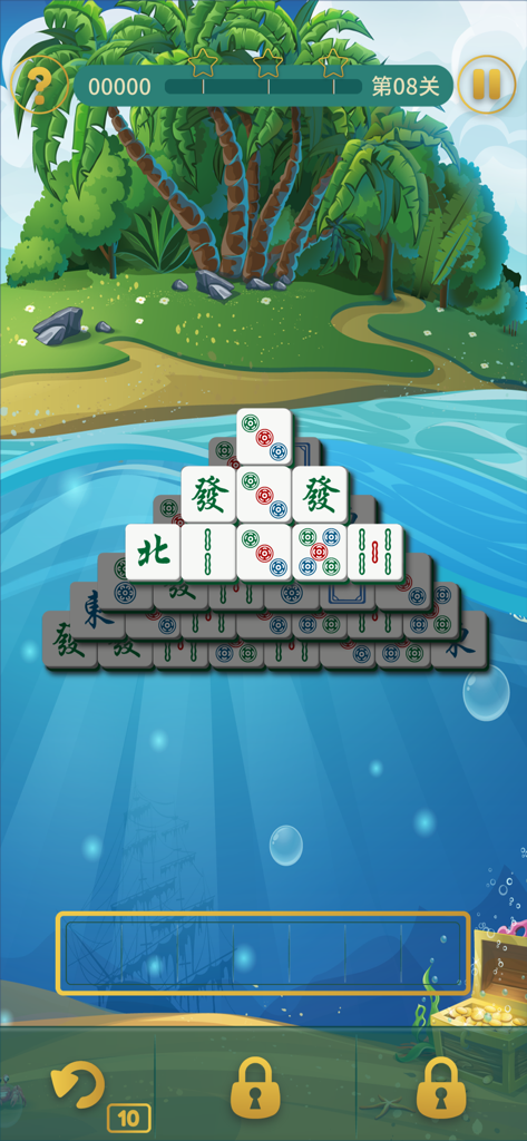 Mahjong Craft gameplay featuring a pyramid of tiles over a beach and underwater background
