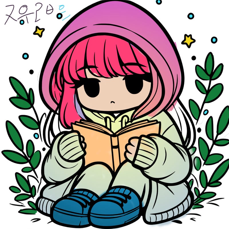 girl in oversized hoodie reading a book