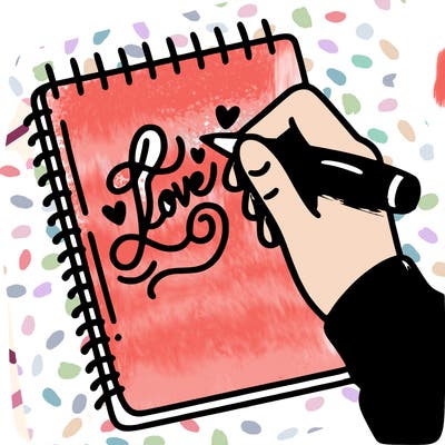 a hand writing “love” in calligraphy on a notebook