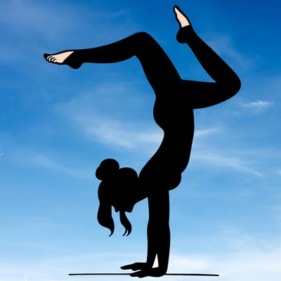 a woman doing a handstand