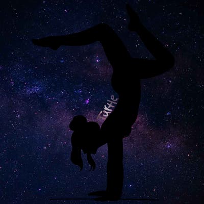 a woman doing a handstand