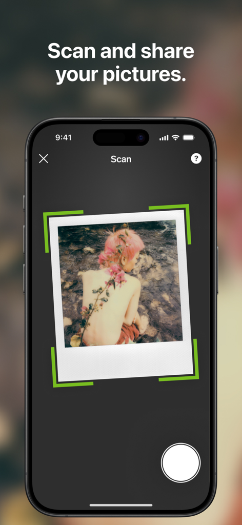 A smartphone screen showing the Polaroid app's scan feature with a green frame capturing a physical instant photograph