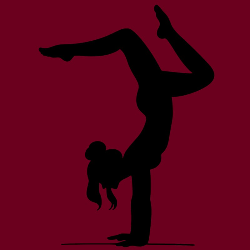 a woman doing a handstand