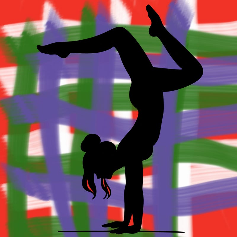 a woman doing a handstand