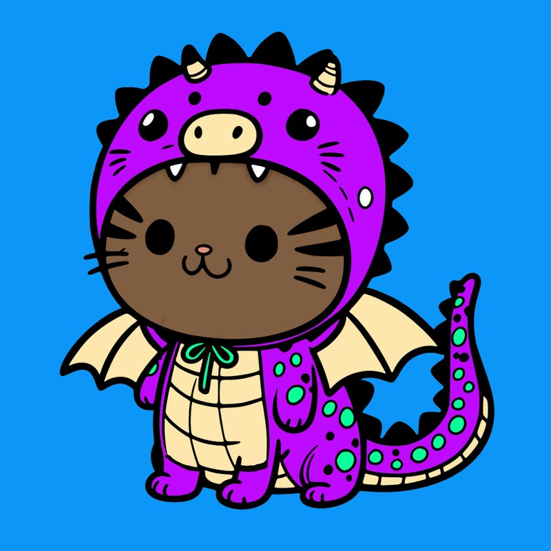 small cat wearing a dragon costume