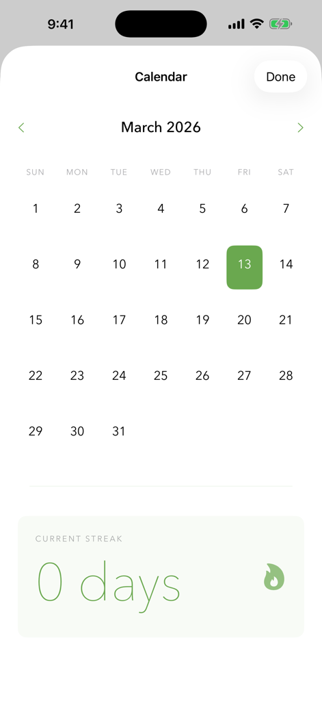 Dharma Wellness - Vista de calendario de la aplicación Dharma Wellness que muestra rachas de meditación y seguimiento de hábitos.