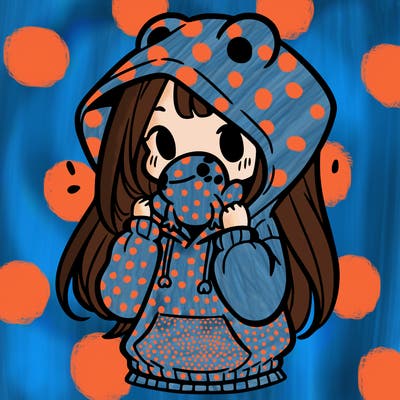 a girl holding a froggy hoodie