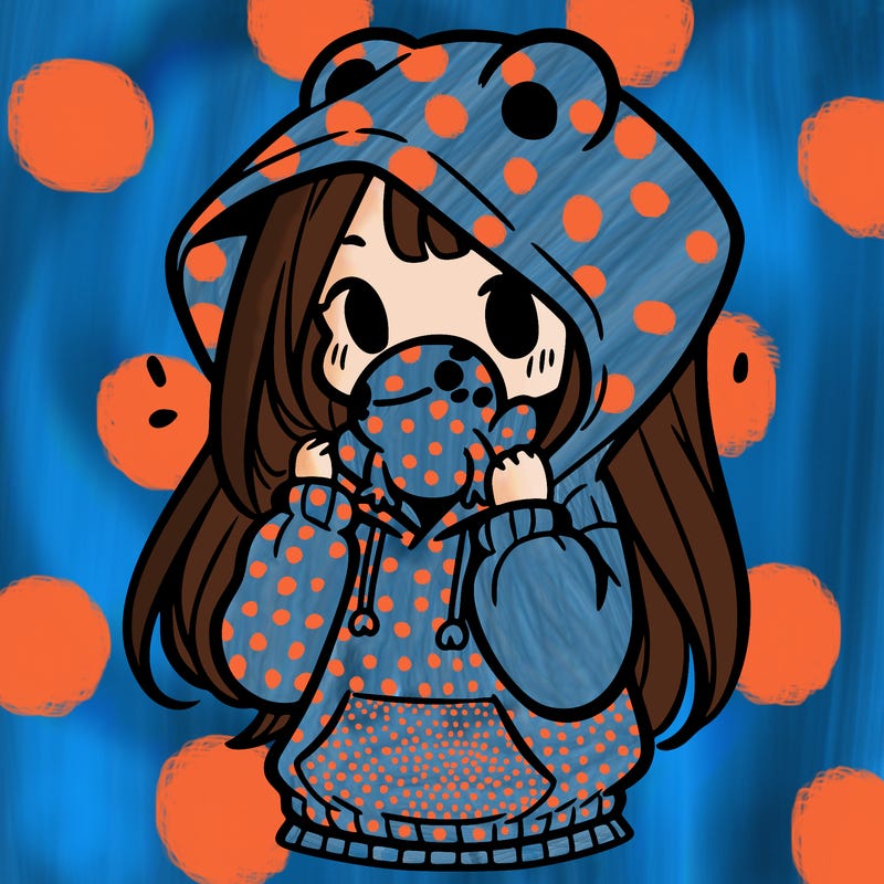 a girl holding a froggy hoodie