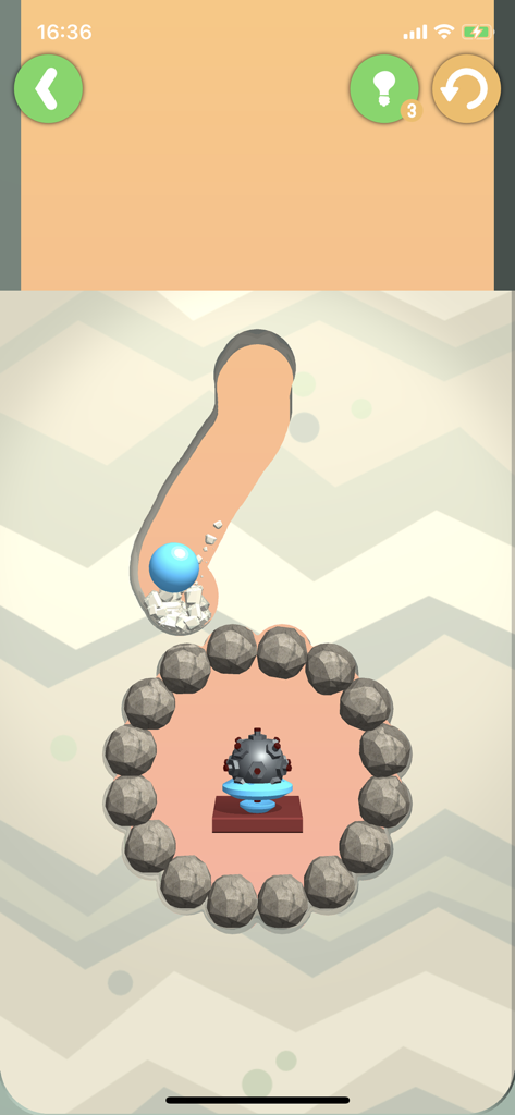 Dig This! - Dig Thisモバイルゲームで、青いボールが砂に掘られた道を進み、爆弾の障害物に向かう様子