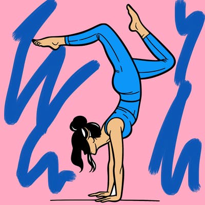 a woman doing a handstand