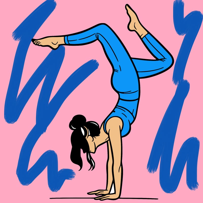 a woman doing a handstand