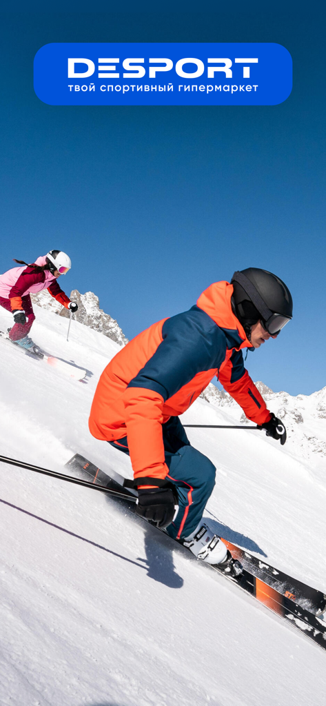 Two people skiing down a snowy mountain slope under the Desport brand logo