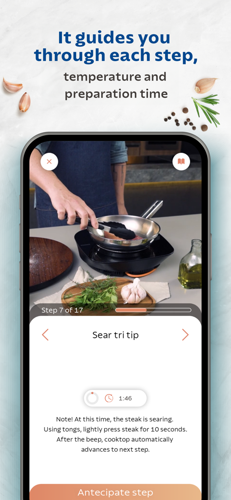 Tramontina Guru - Tramontina Guru app interface showing a step-by-step guided recipe for searing a steak with video and timer