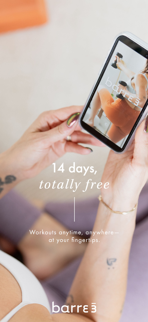 barre3 online - A woman holding a smartphone displaying the barre3 online fitness app with a fourteen day free trial promotion.