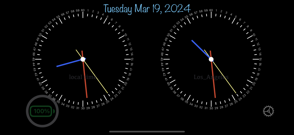Always On Display - Relojes analógicos dobles que muestran la hora local y de Los Ángeles con un indicador de batería en un fondo oscuro.