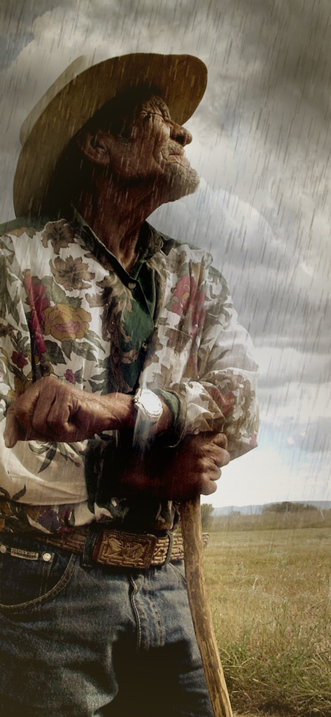 Rainy Daze - リアルな雨の効果で、杖に寄りかかる高齢男性のポートレート。