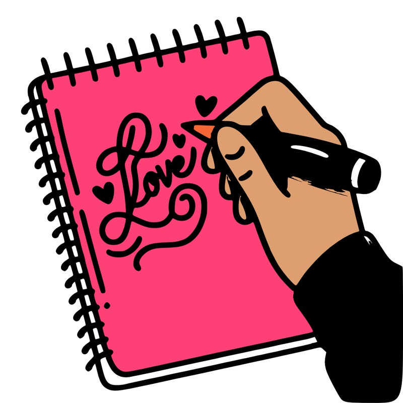 a hand writing “love” in calligraphy on a notebook