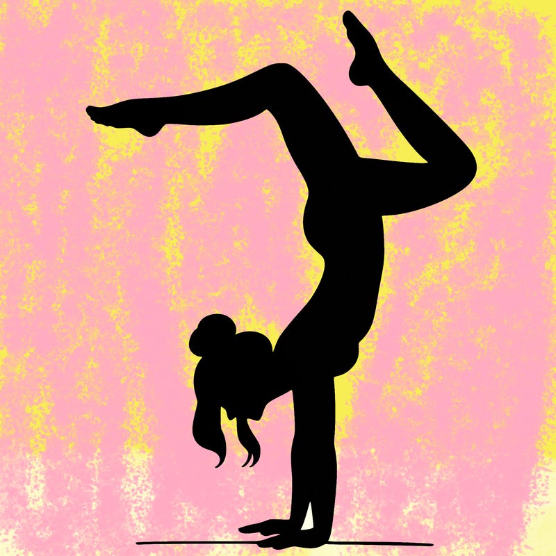 a woman doing a handstand