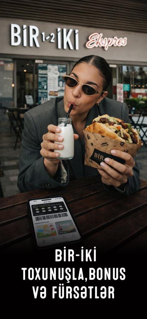 Bir İki Doner Shop - A young woman enjoying a doner kebab at Bir Iki shop with the loyalty app rewards screen visible on her phone