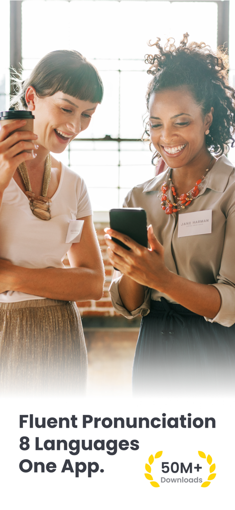 Accent Training - Vocabulary - Two professional women smiling and looking at the accent training app during a networking event