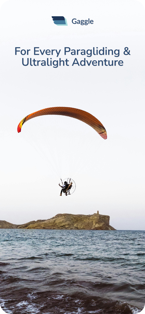 Gaggle Paragliding, Ultralight - A pilot paramotoring over the ocean near a rocky coastline with Gaggle app branding