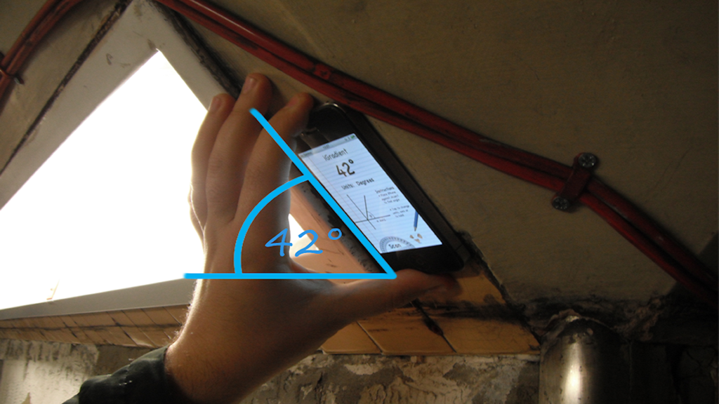 Person using iGradient app on iPhone to measure a 42 degree angle