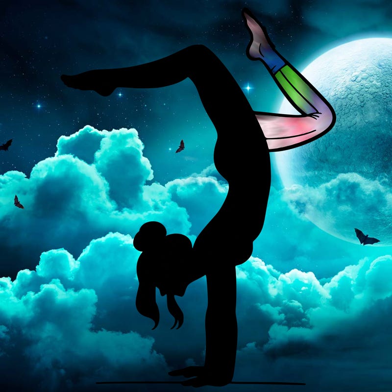 a woman doing a handstand