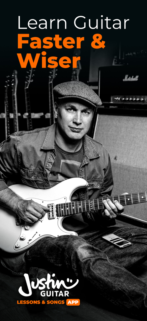 Justin Guitar Lessons & Songs - Justin Sandercoe playing electric guitar with text Learn Guitar Faster and Wiser.