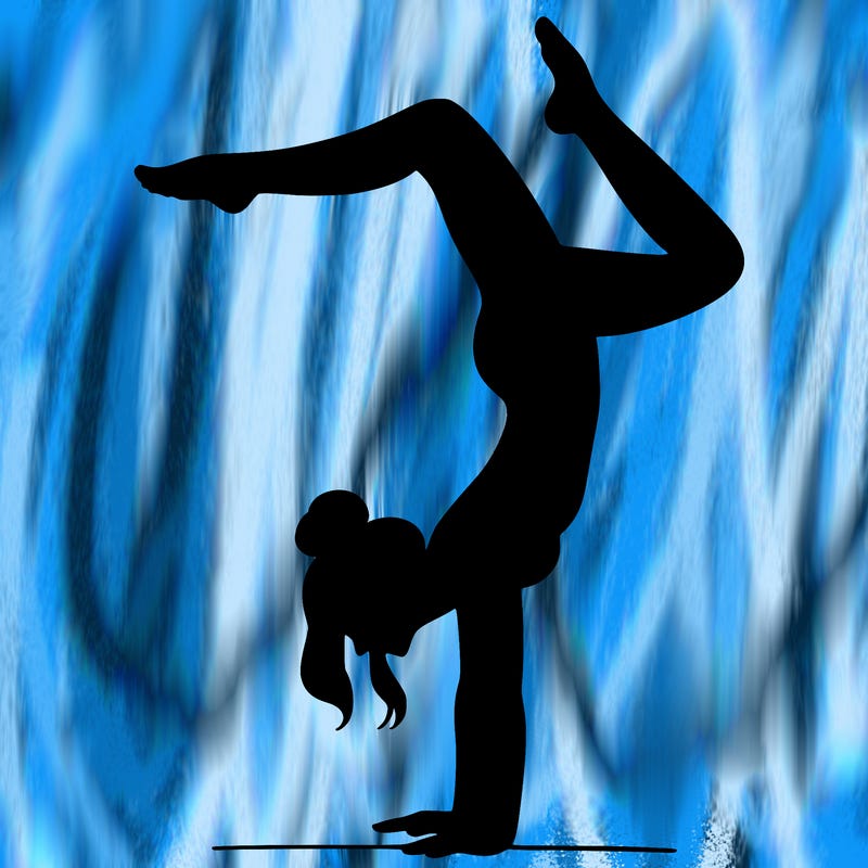 a woman doing a handstand