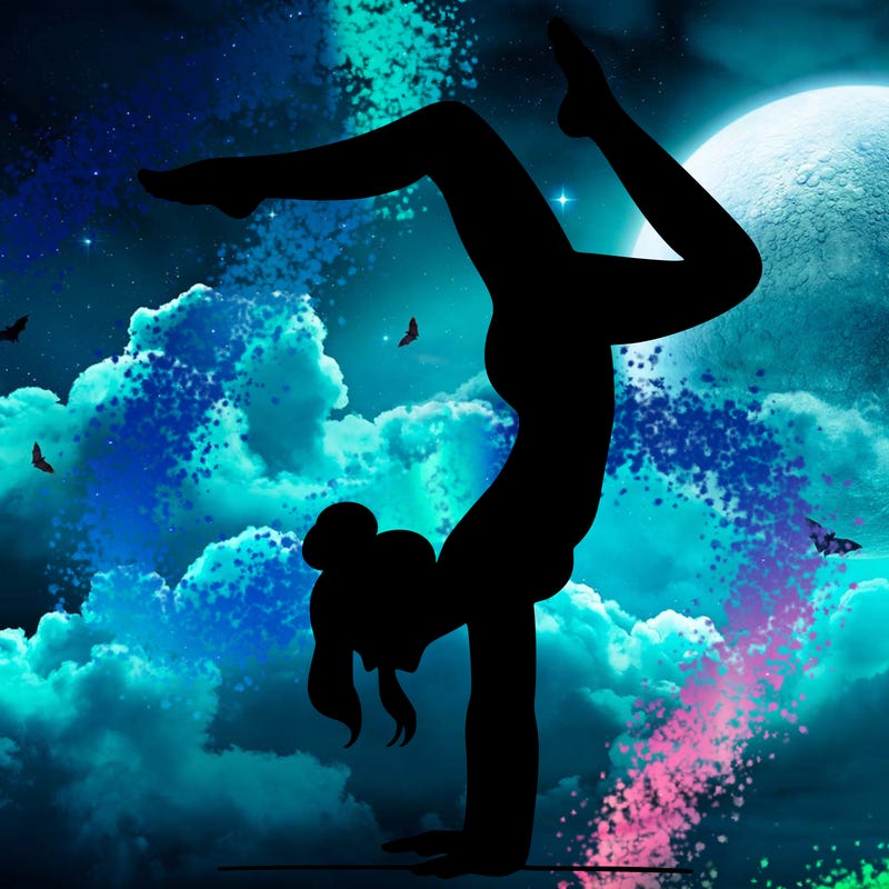 a woman doing a handstand