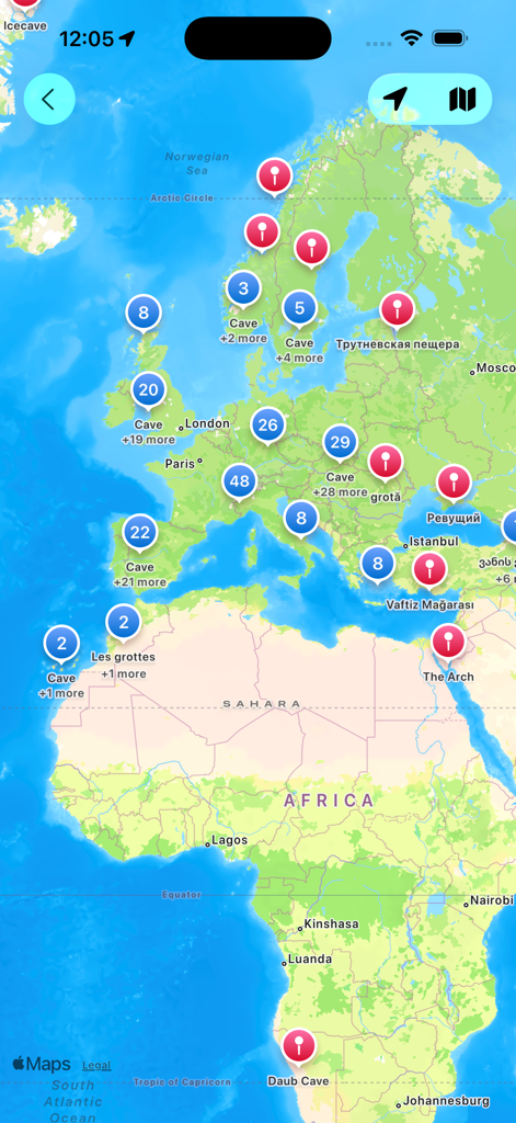 Cave Map - An interactive world map within the Cave Map app showing numerous cave locations and clusters across Europe and Africa.
