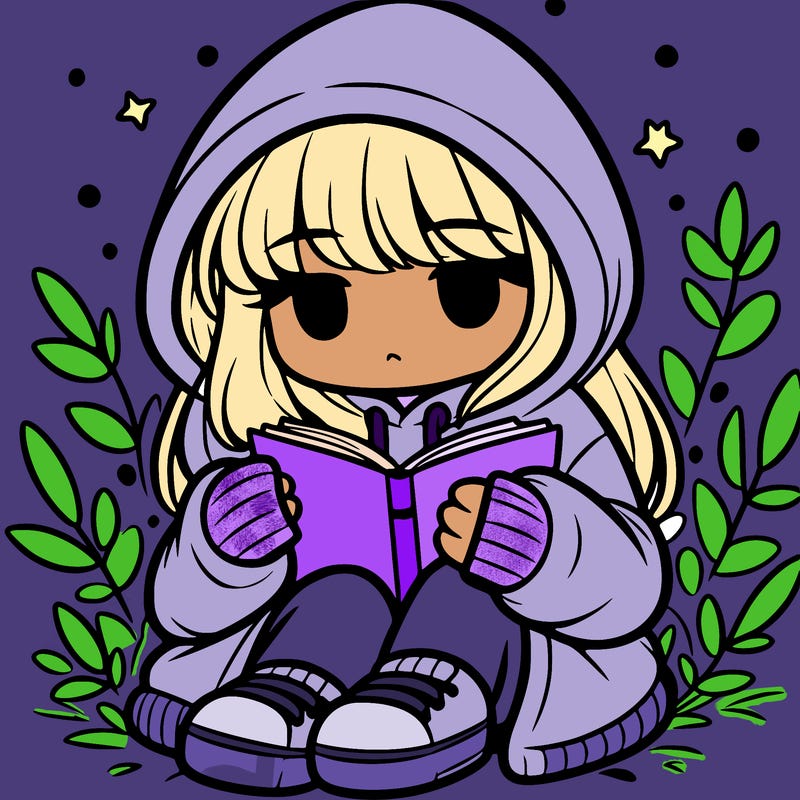 girl in oversized hoodie reading a book